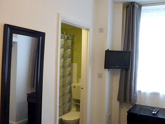 Relax in the private bathroom in your room at Notting Hill Hotel