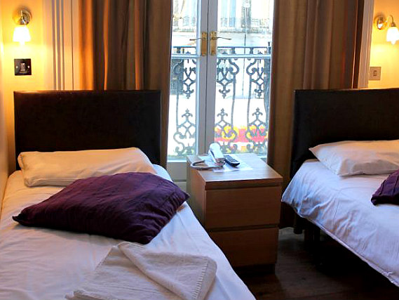 A twin room at New Dawn Hotel London is perfect for a two guests