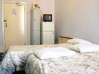 A typical triple room at Acacia Hostel London