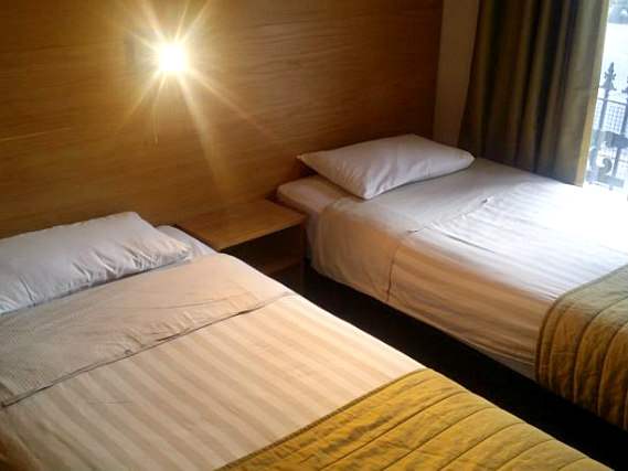 A spacious twin room at Arriva Hotel