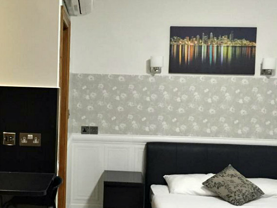 Une chambre à Paddington Apartments