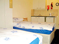 A twin room at Athena Palace Hotel