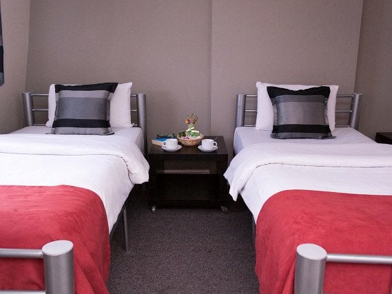 Une chambre avec lits jumeaux de Hyde Park View Hostel