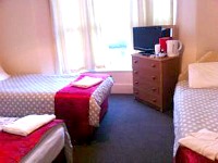 A typical quad room at Stratford Hotel London