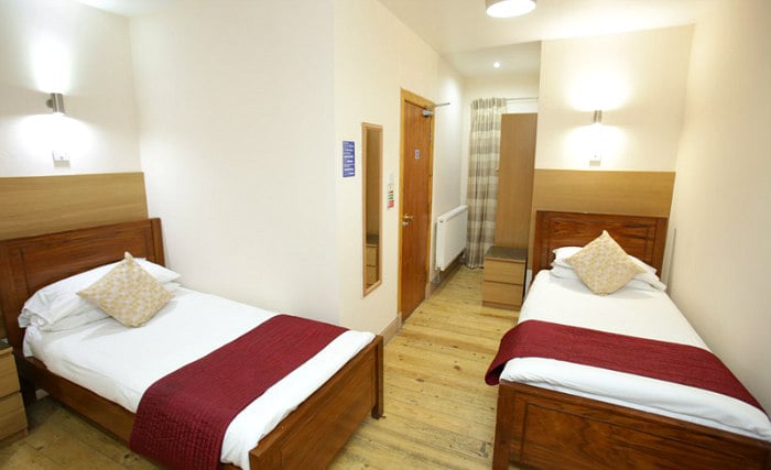 Une chambre avec lits jumeaux de Merchant City Inn