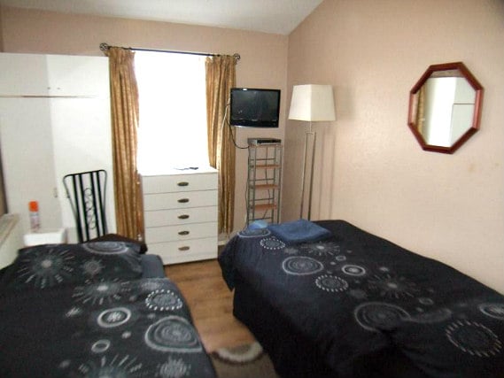 Une chambre avec lits jumeaux de Cherish Lodge