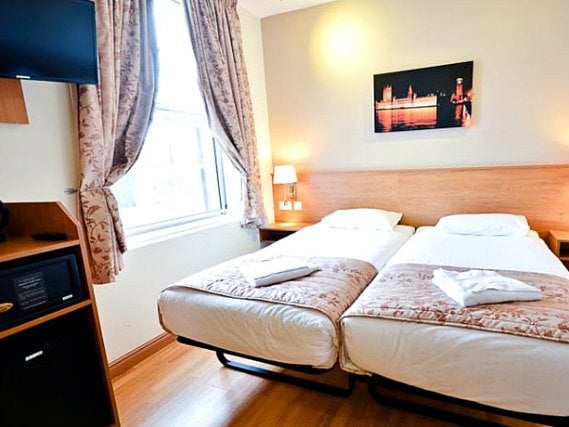 A twin room at Kings Cross Inn Hotel is perfect for two guests