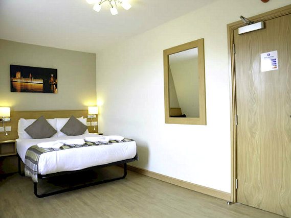 Get a good night's sleep in your comfortable room at Kings Cross Inn Hotel