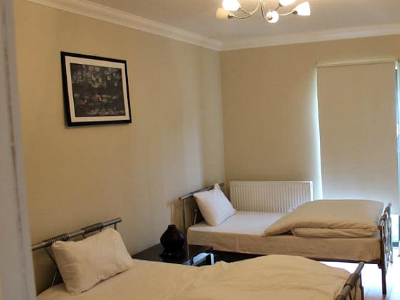 A twin room at London Apartments at Romford