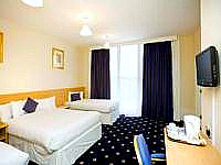 A triple room at Queens Hotel London