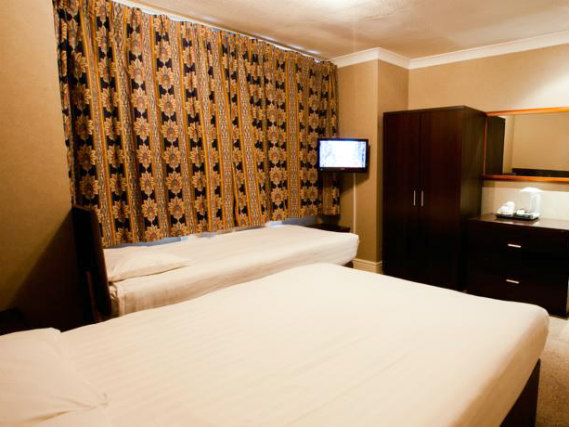 A twin room at Rossmore Hotel