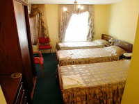 A typical triple room at Exhibition Court Hotel 1