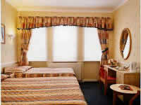 A twin room at Kyriad Hotel London