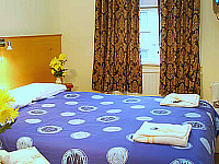 A Typical Double Bedroom at Arriva Hotel