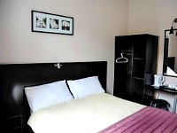 A Typical Double Bedroom at Arriva Hotel