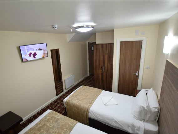 A comfortable twin room at Lucky 8 Hotel