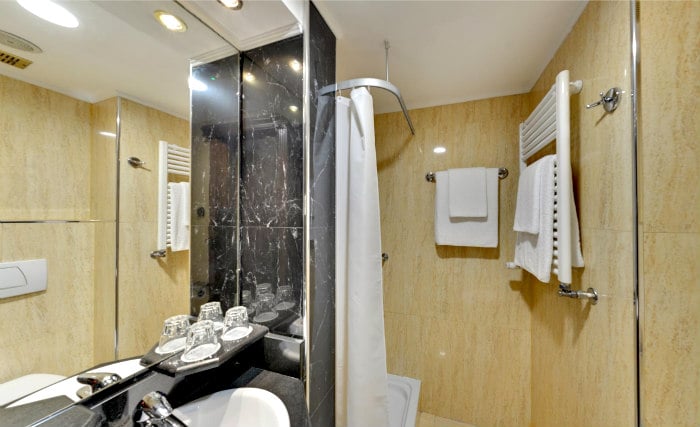 Relax in the private bathroom in your room at Melia White House Hotel