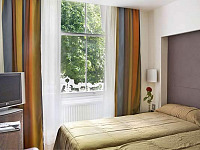 A twin room at Caesar Hotel London