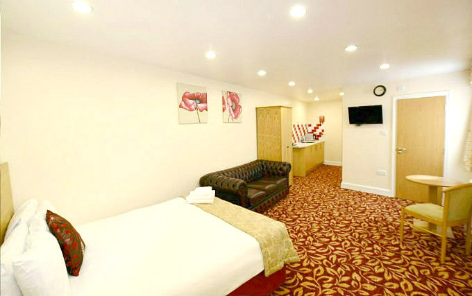 A comfortable double room at PremierLux Serviced Apartments