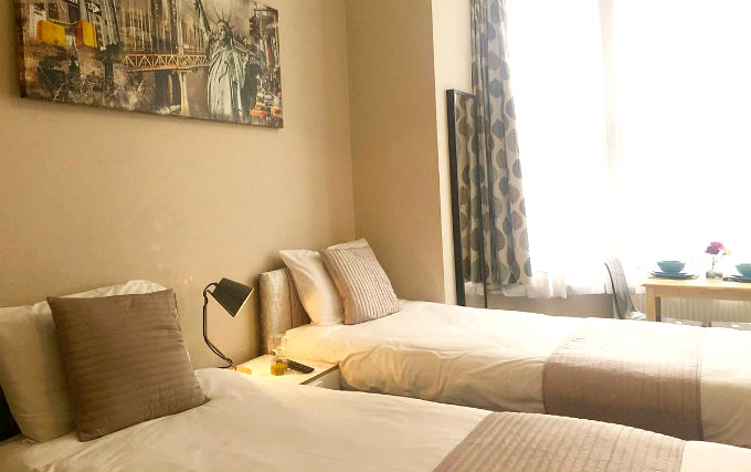 A typical triple room at United Lodge Hotel and Apartments