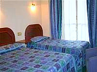 A Typical Triple Room at Hyde Park Whiteleaf Hotel