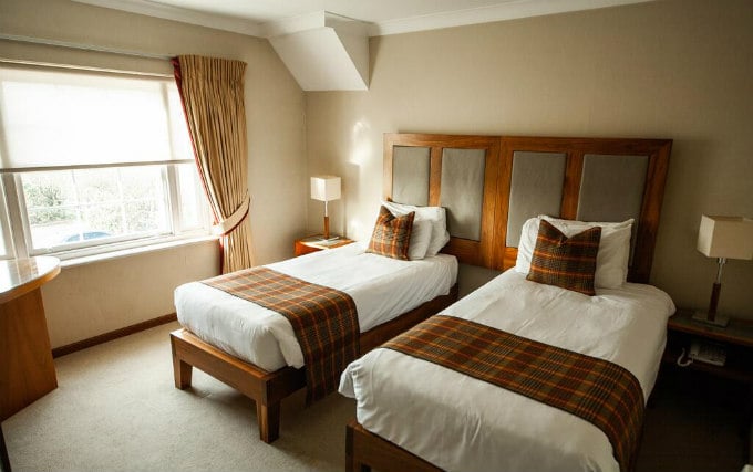 A comfortable twin room at Berwick Manor Hotel