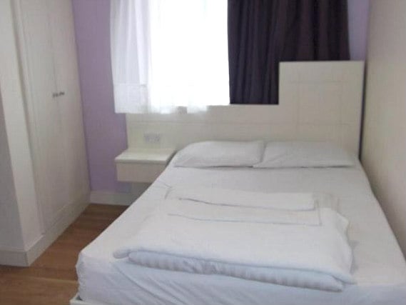 A comfortable double room at The London Pembury Hotel