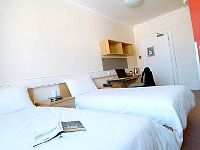 A Typical Simple and Clean Ensuite Twin Room at Northumberland House