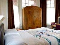 A bedroom at Charlies Hotel London