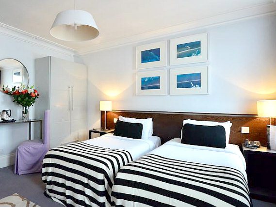 A twin room at Kensington Rooms Hotel is perfect for two guests