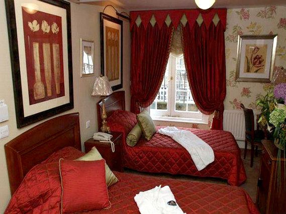 A twin room at Opulence Central London