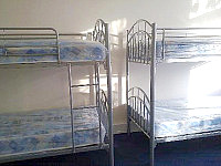 A dorm room, providing basic but comfortable accommodation to larger groups