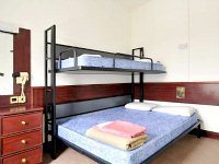 A typical triple room at Equity Point Hostel