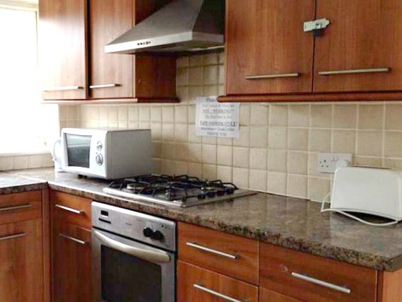 The kitchen at Rooms For You is fully equipped includes a toaster and microwave