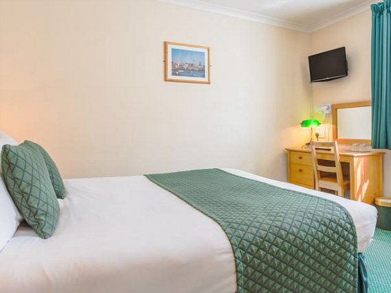 Relax and unwind, and watch TV after a busy day in your cosy double room
