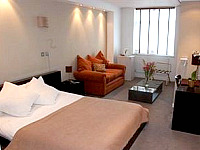 A large guest room at City Hotel London