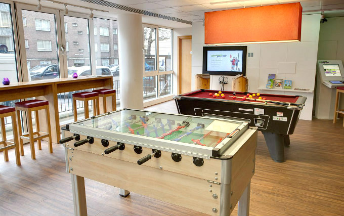 Enjoy a game in the pool room at Meininger Hostel London
