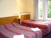 A typical triple room at Hotel 65 London