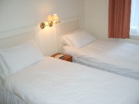 A typical bedroom at Ryder Street Serviced Apartments