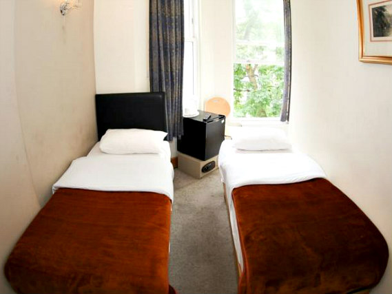 A twin room at Holland Inn Hotel is perfect for two guests