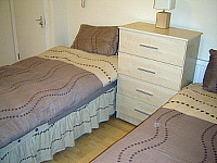 A typical twin bedroom at the Camden Inn Hotel