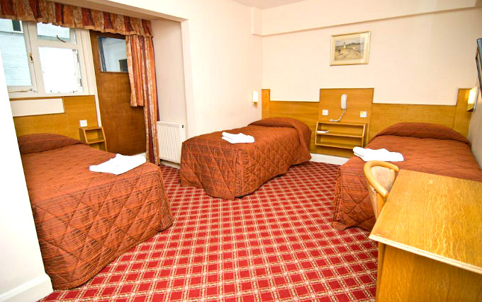 A comfortable triple room at Alexandra Hotel