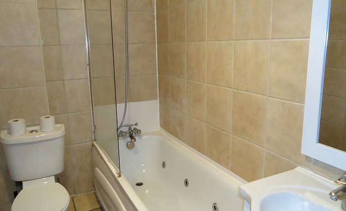 Relax in the private bathroom in your room at Access Apartments Earls Court
