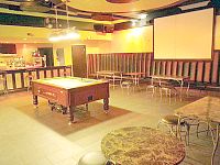 Bar area, with pool table, big screen and table seating