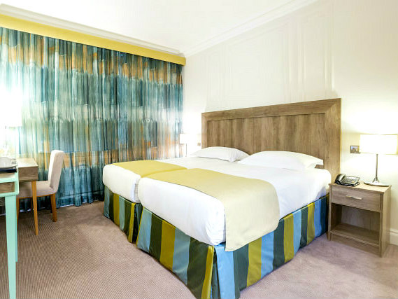 A comfortable double twin room at Astor Court Hotel