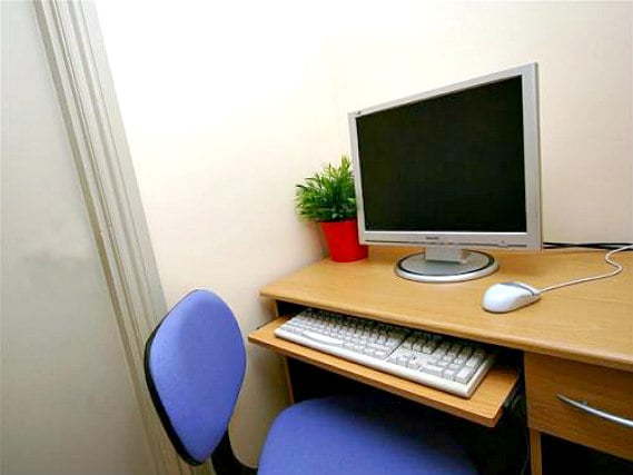 Most rooms have desks at the All Star Hostel London