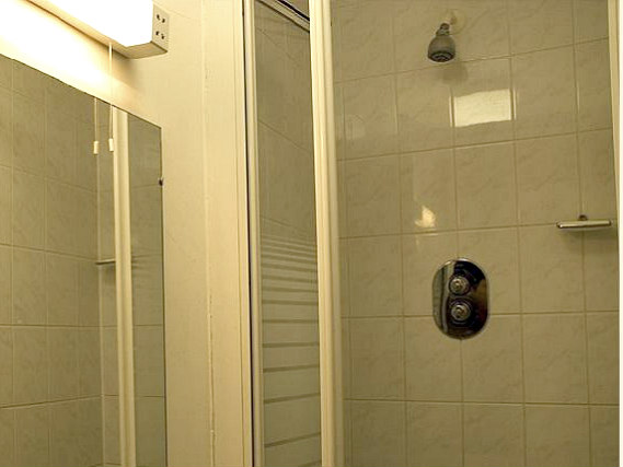 Relax in the private bathroom in your room at Palace Court Hotel London