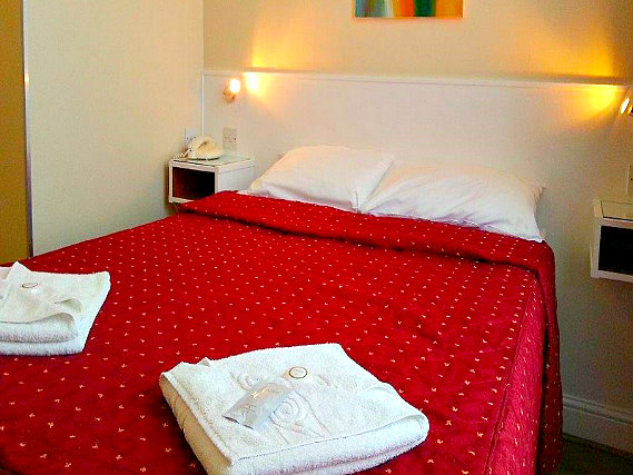 Rest easy in a comfortable bed in your room