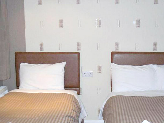 A typical triple room at Linden House Hotel
