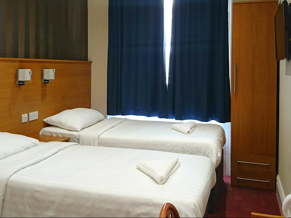 Une chambre avec lits jumeaux de Mina House Hotel London